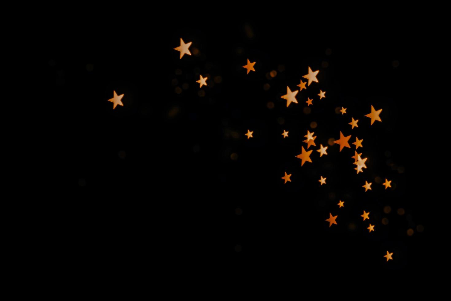 abstract bokeh background of golden light burst made from bokeh motion. photo