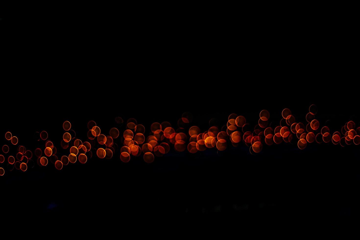 abstract bokeh background of golden light burst made from bokeh motion. photo
