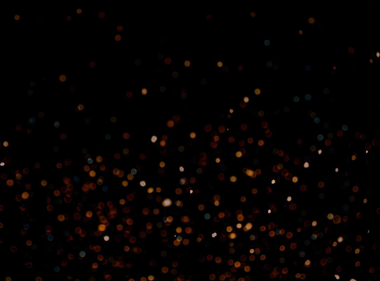 abstract bokeh background of golden light burst made from bokeh motion. photo