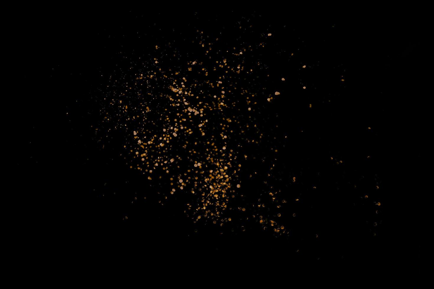 abstract bokeh background of golden light burst made from bokeh motion. photo