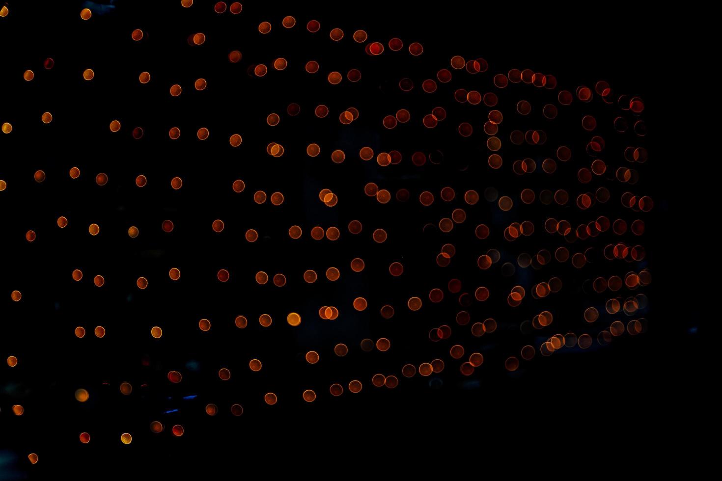 abstract bokeh background of golden light burst made from bokeh motion. photo