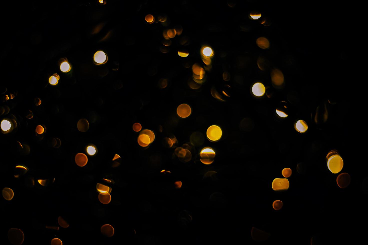 abstract bokeh background of golden light burst made from bokeh motion. photo
