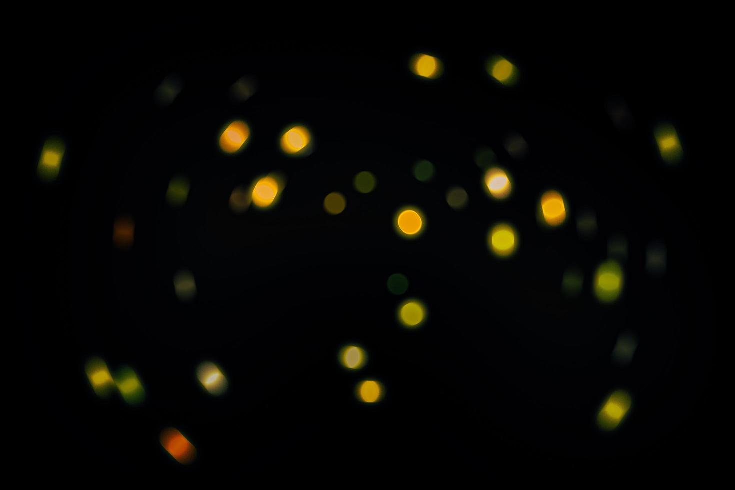 abstract bokeh background of golden light burst made from bokeh motion. photo
