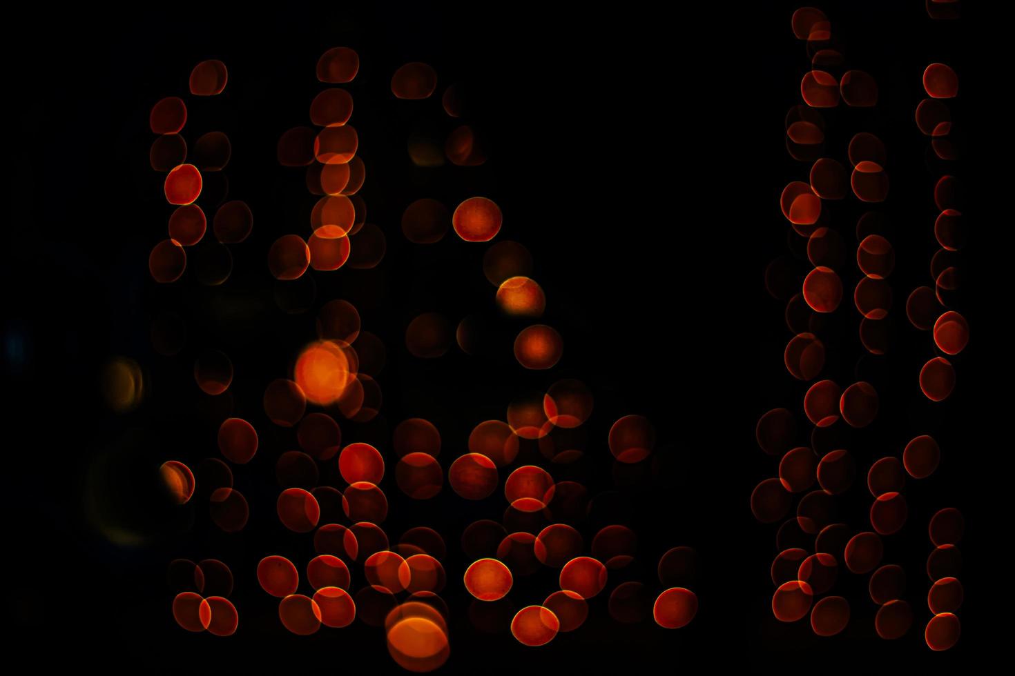 abstract bokeh background of golden light burst made from bokeh motion. photo