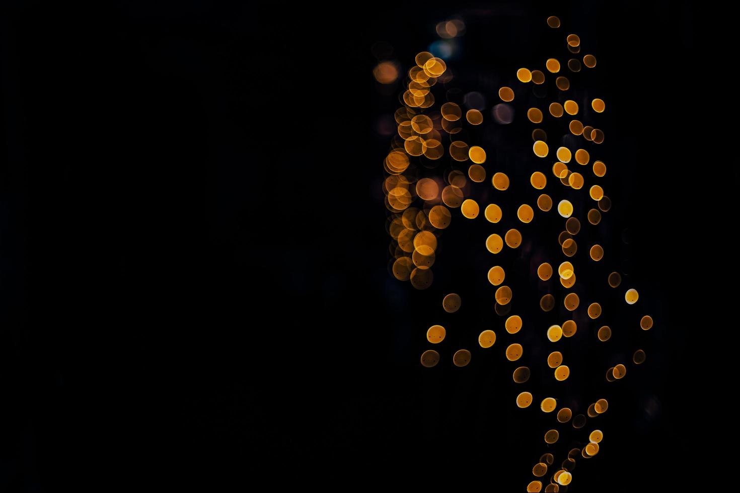 abstract bokeh background of golden light burst made from bokeh motion. photo