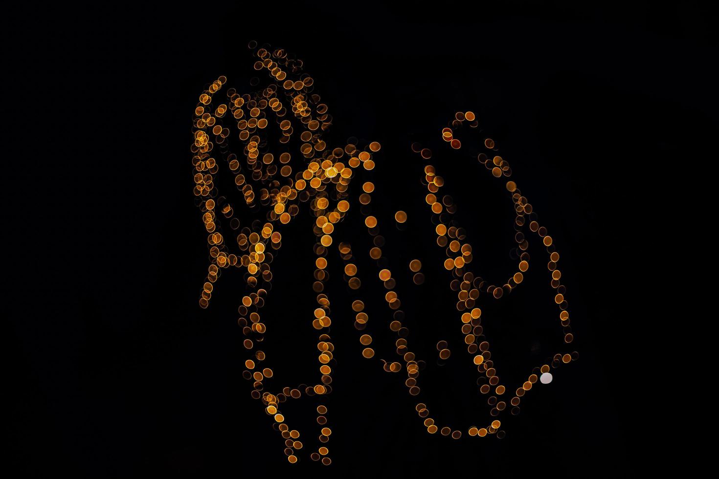 abstract bokeh background of golden light burst made from bokeh motion. photo