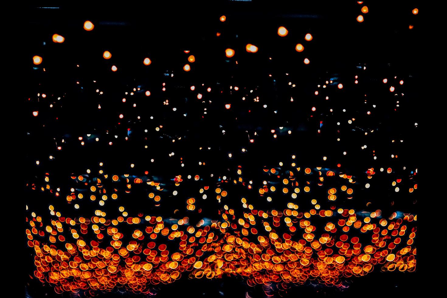 abstract bokeh background of golden light burst made from bokeh motion. photo