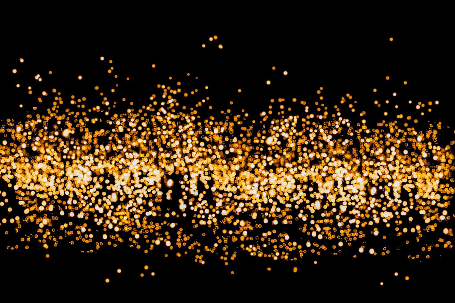 abstract bokeh background of golden light burst made from bokeh motion. photo
