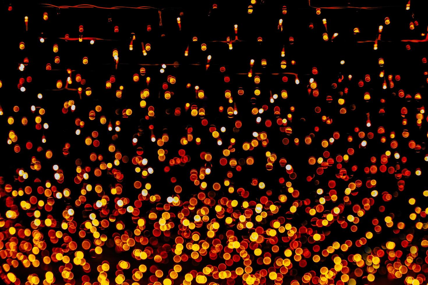 abstract bokeh background of golden light burst made from bokeh motion. photo