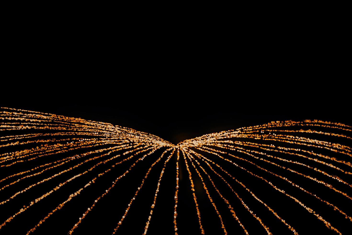 abstract bokeh background of golden light burst made from bokeh motion. photo