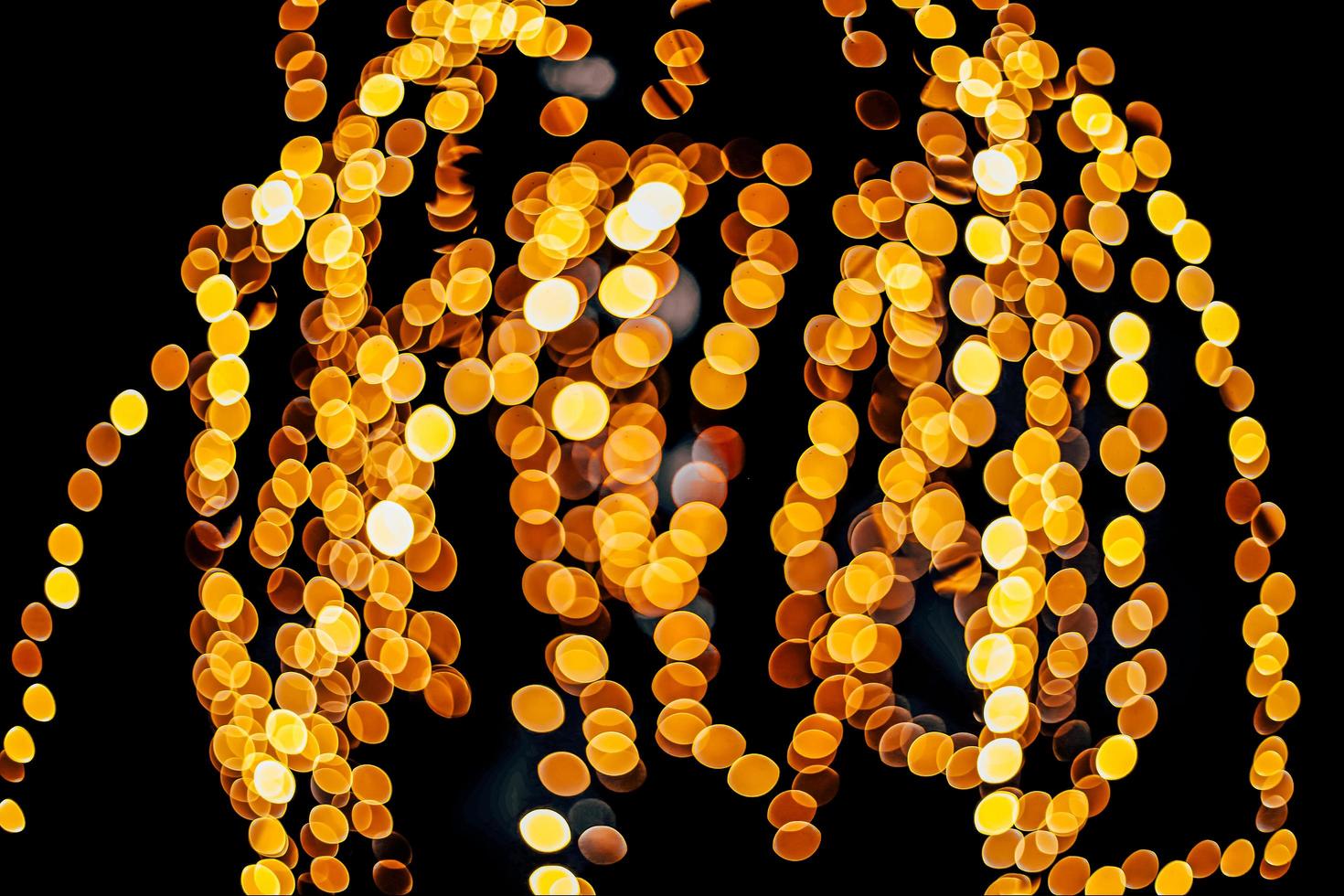 abstract bokeh background of golden light burst made from bokeh motion. photo