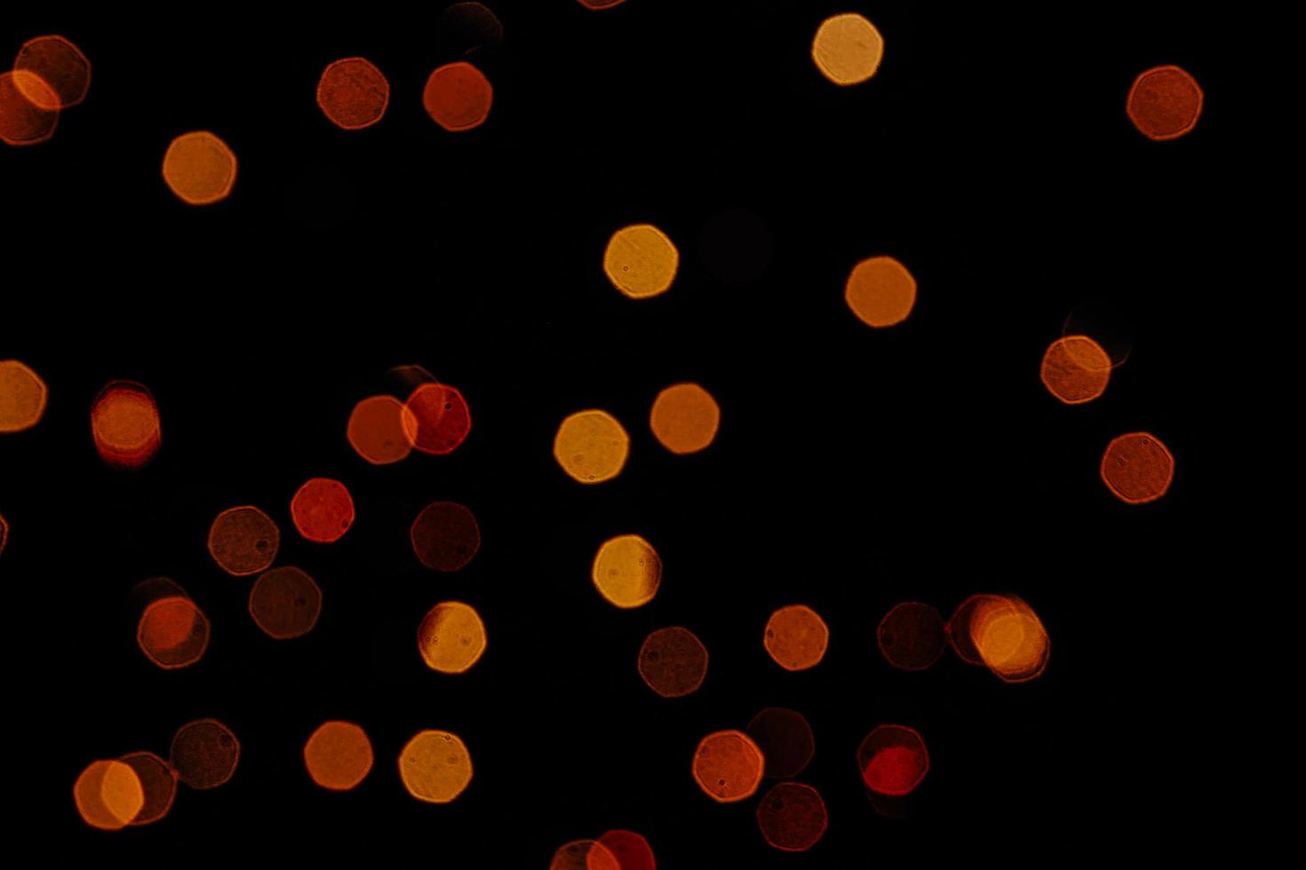 abstract bokeh background of golden light burst made from bokeh motion. photo