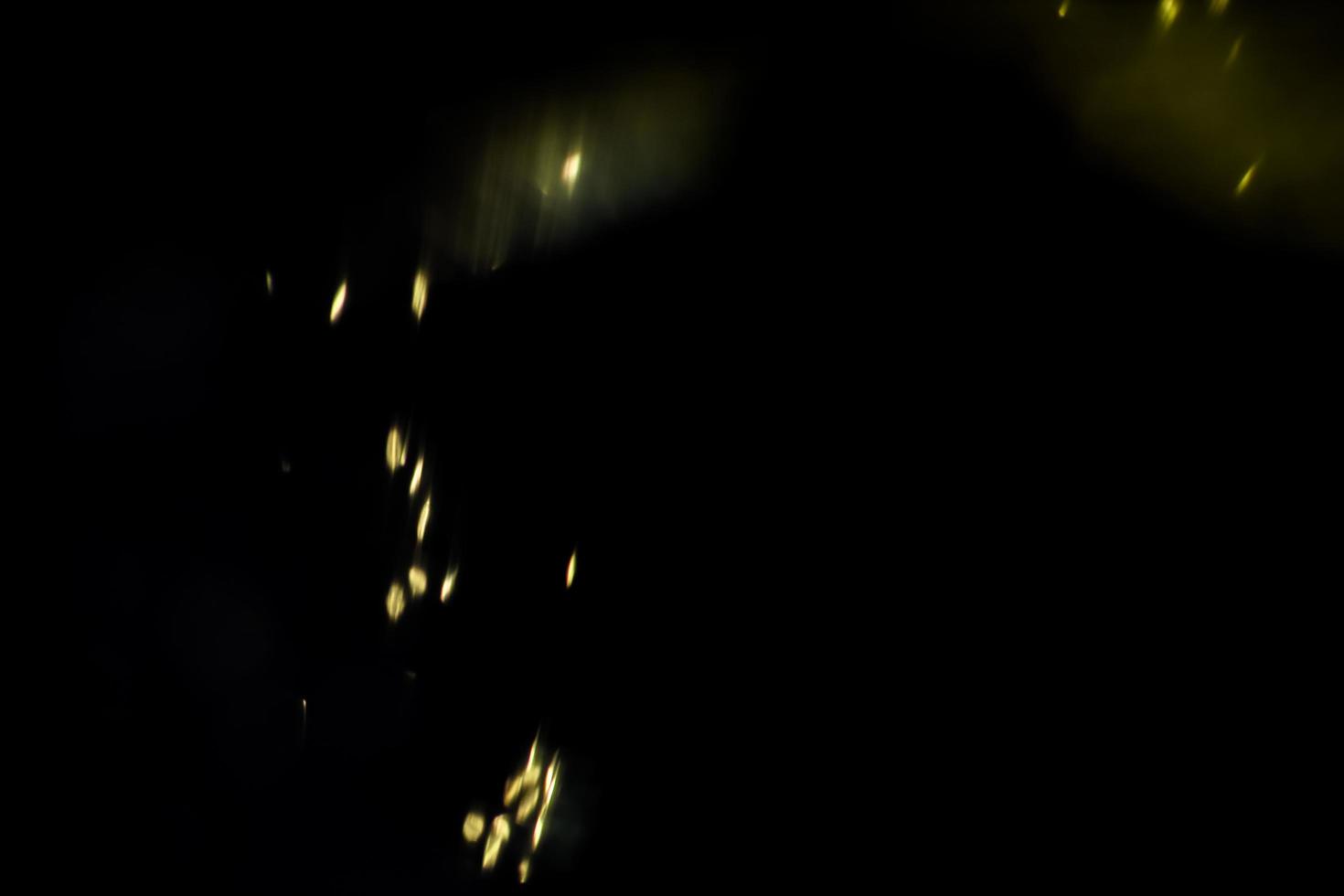 background of abstract glitter lights. gold and black. de focused photo