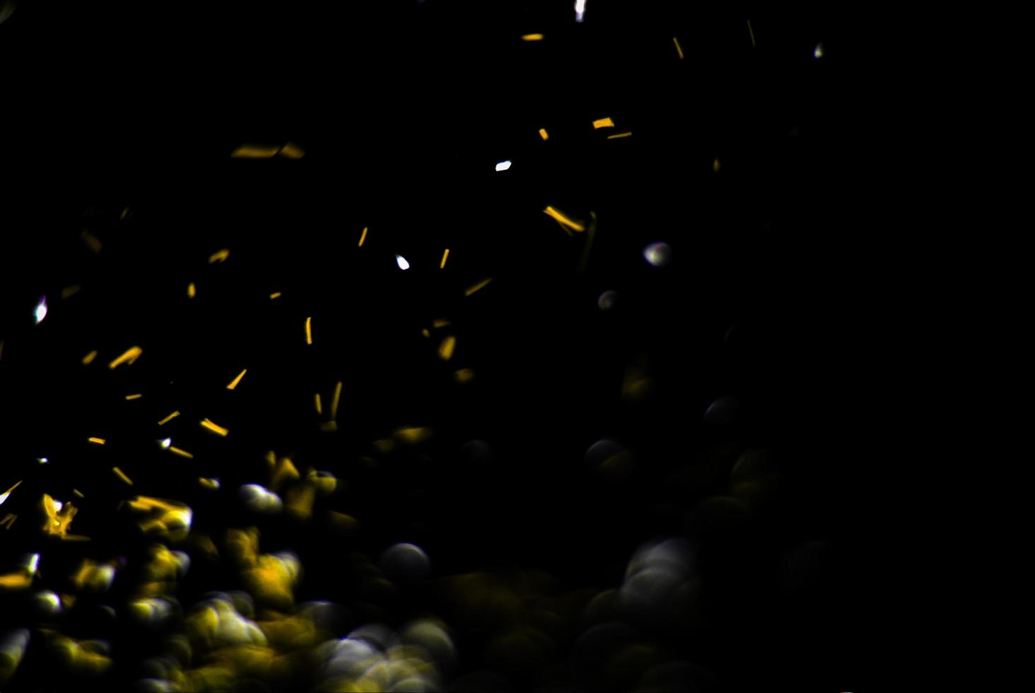 background of abstract glitter lights. gold and black. de focused photo