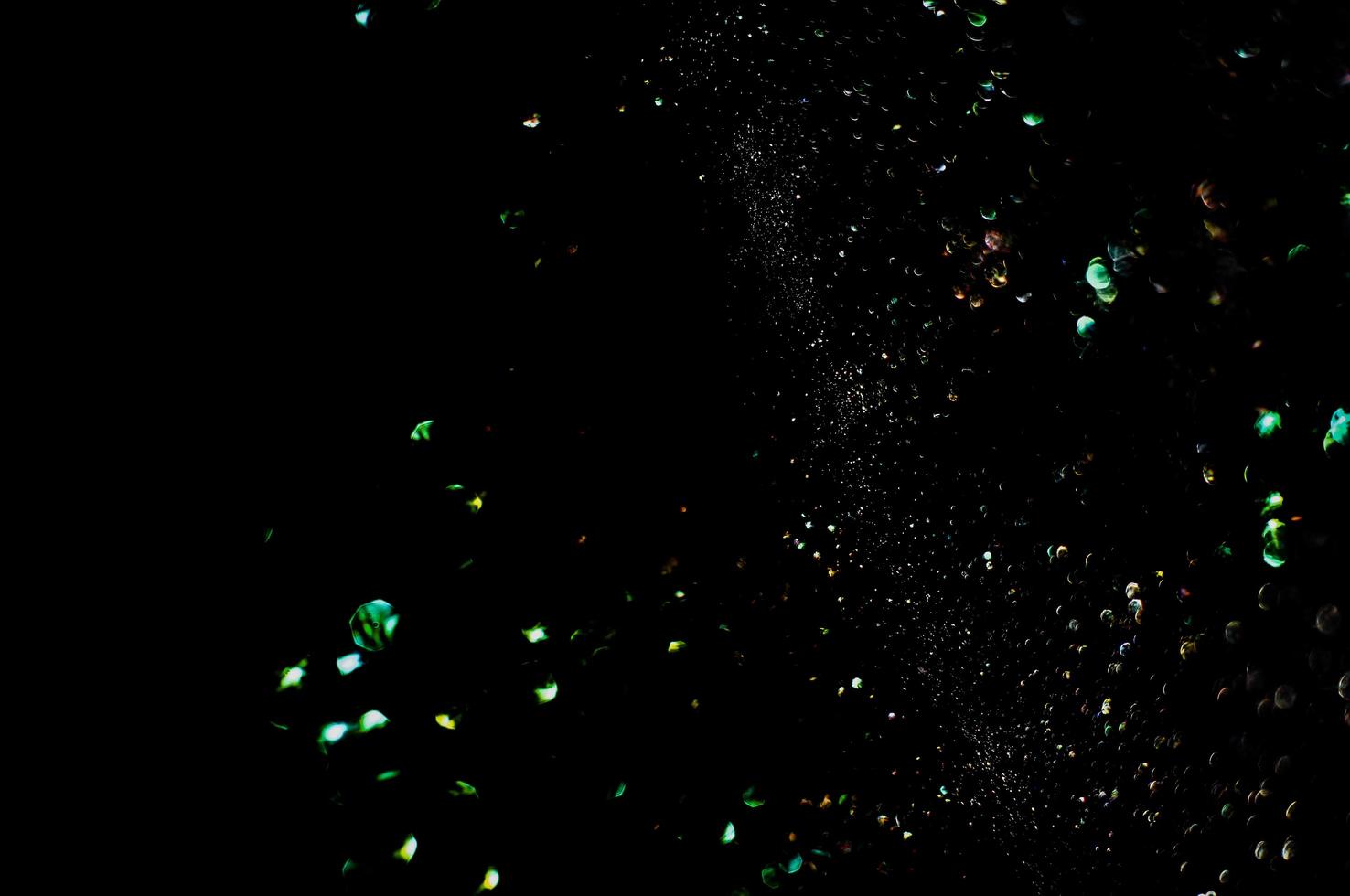 background of abstract glitter lights. gold and black. de focused photo