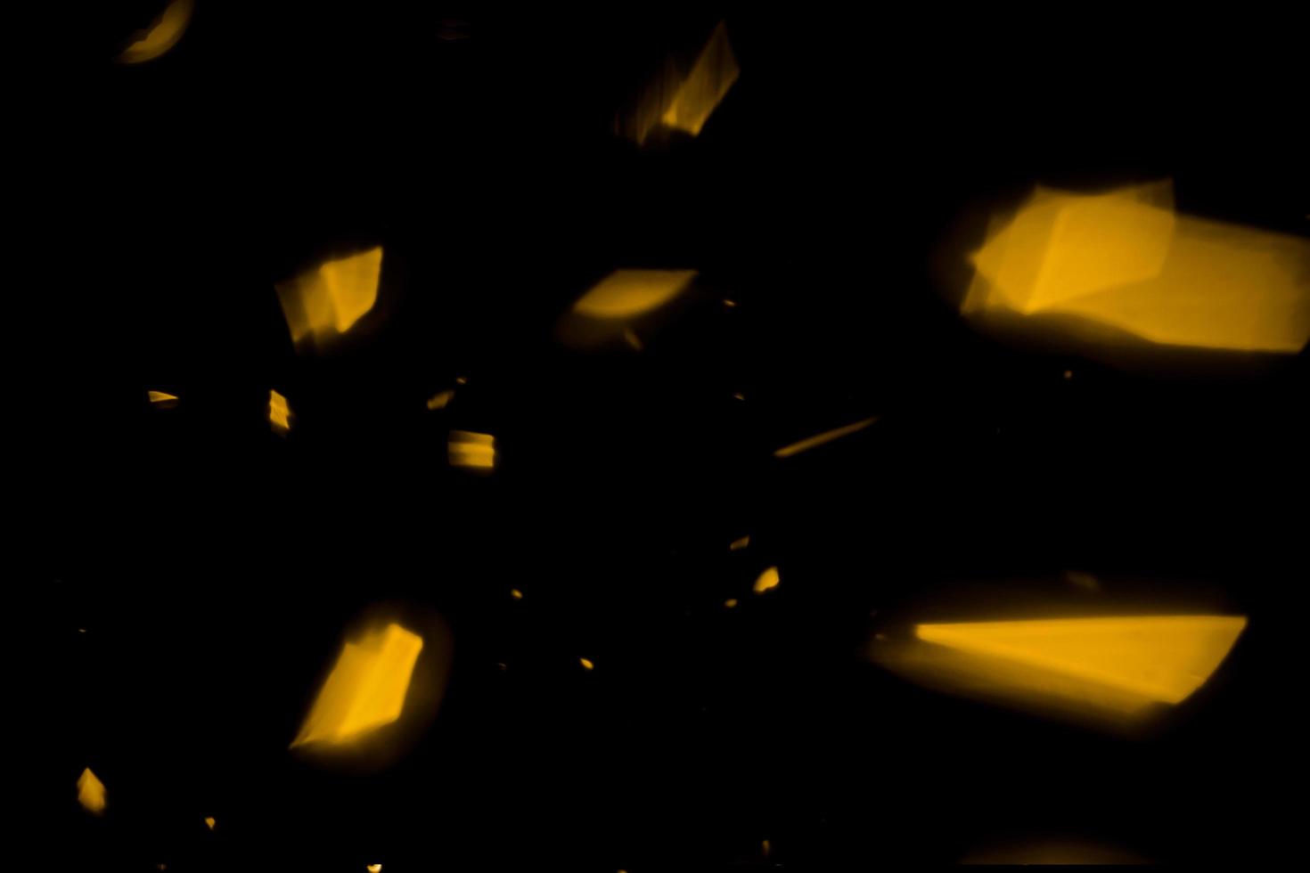 background of abstract glitter lights. gold and black. de focused photo