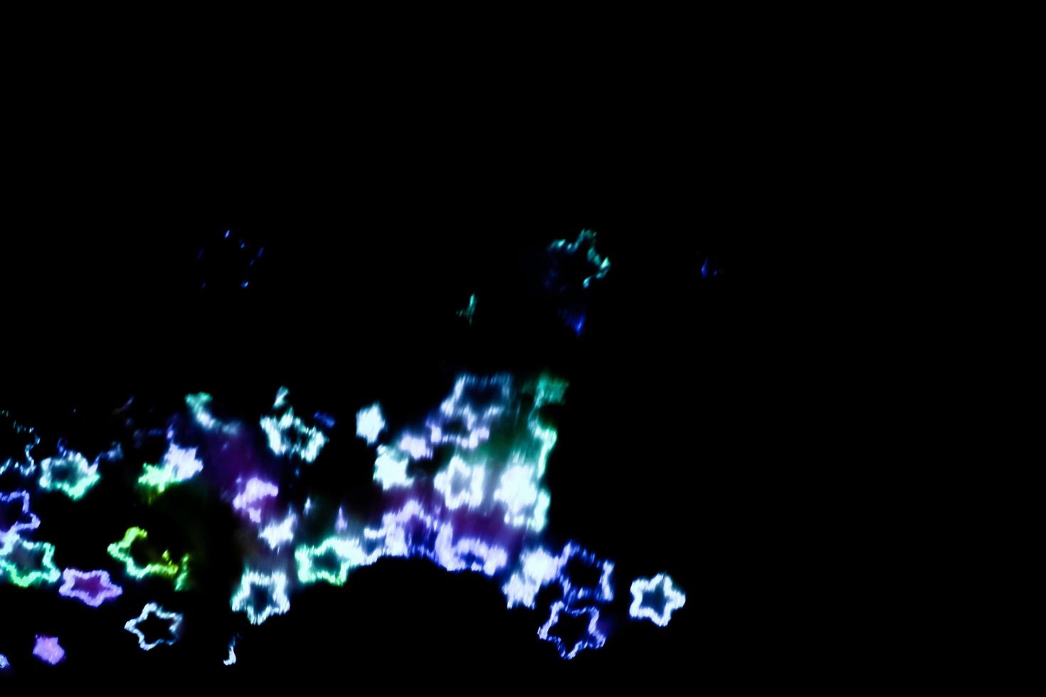 background of abstract glitter lights. gold and black. de focused photo