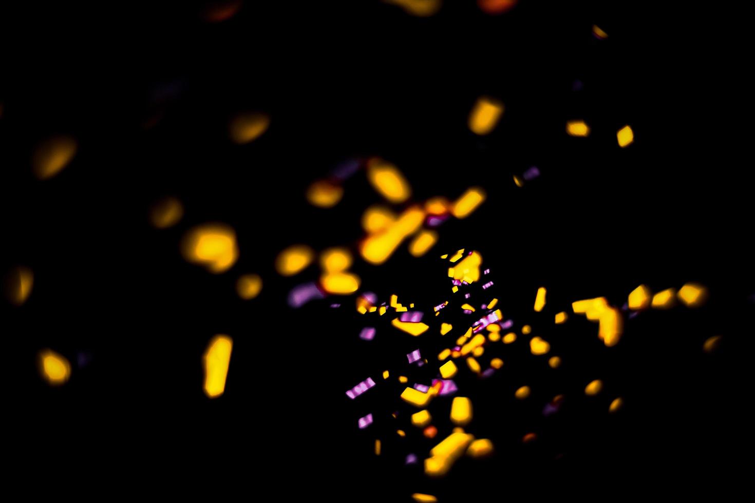 background of abstract glitter lights. gold and black. de focused photo
