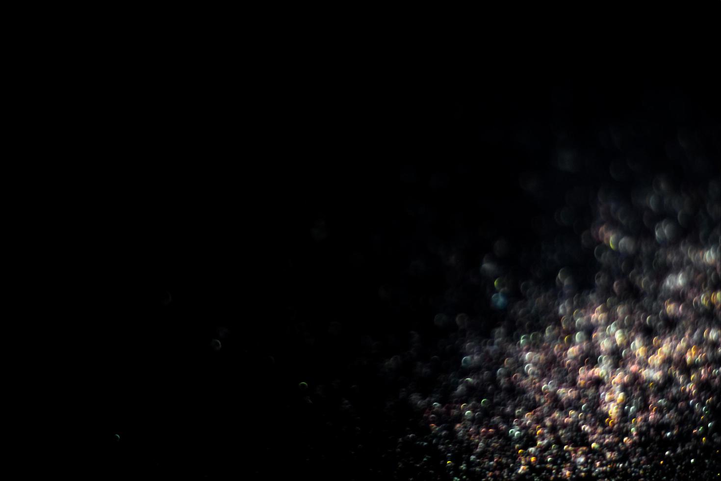 background of abstract glitter lights. gold and black. de focused photo