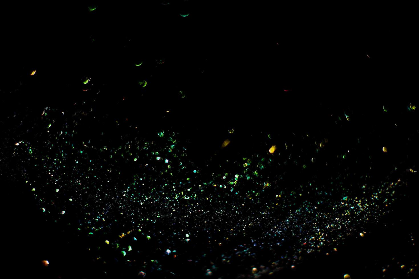 background of abstract glitter lights. gold and black. de focused photo