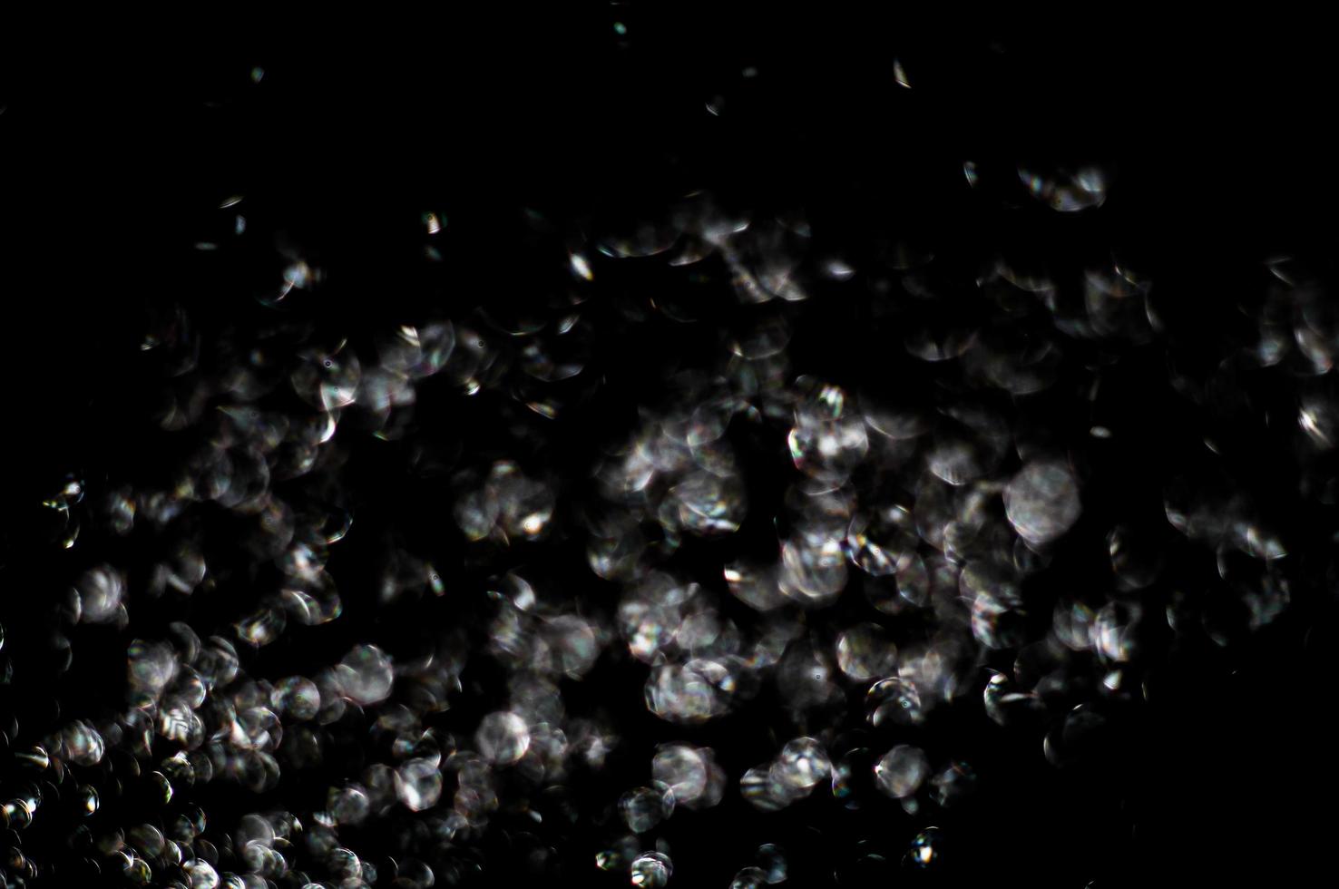background of abstract glitter lights. gold and black. de focused photo