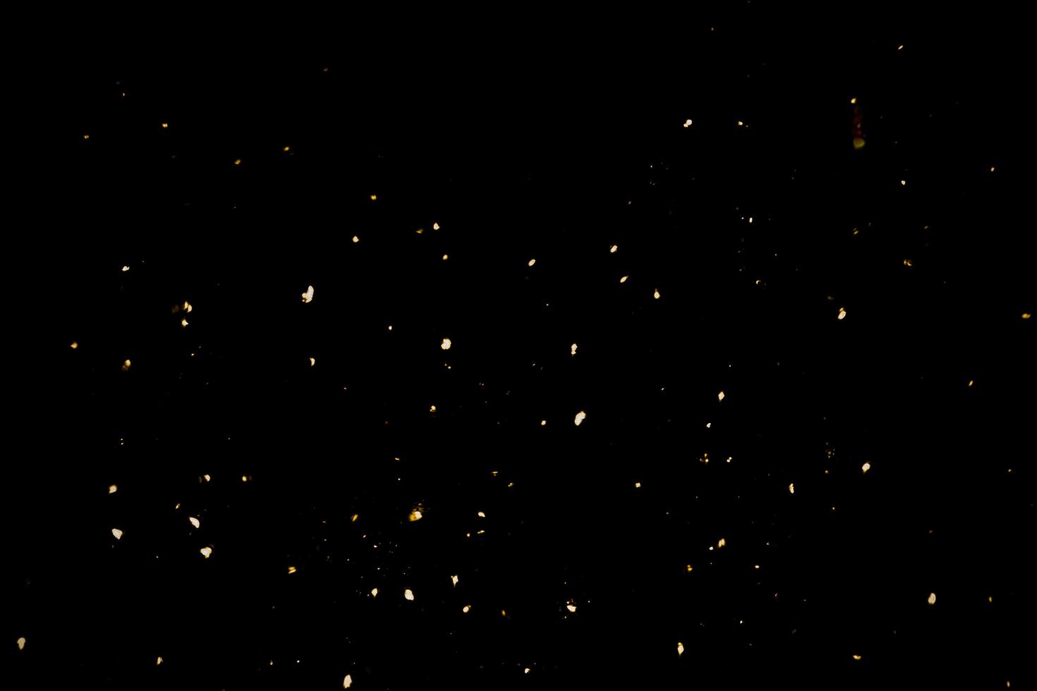 background of abstract glitter lights. gold and black. de focused photo