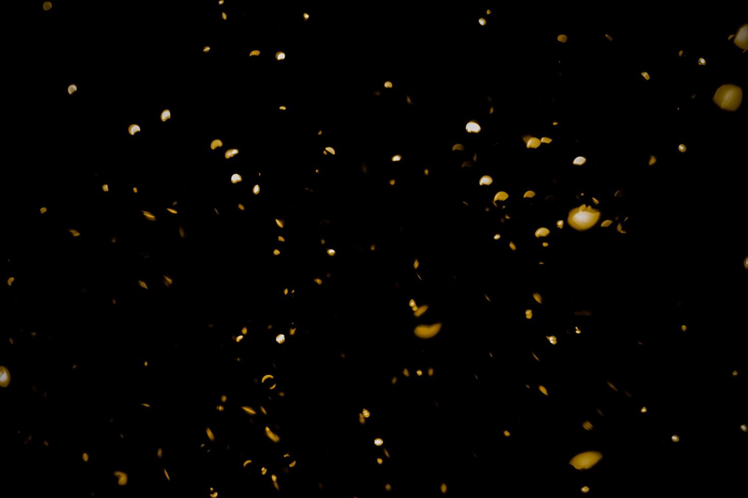 background of abstract glitter lights. gold and black. de focused photo