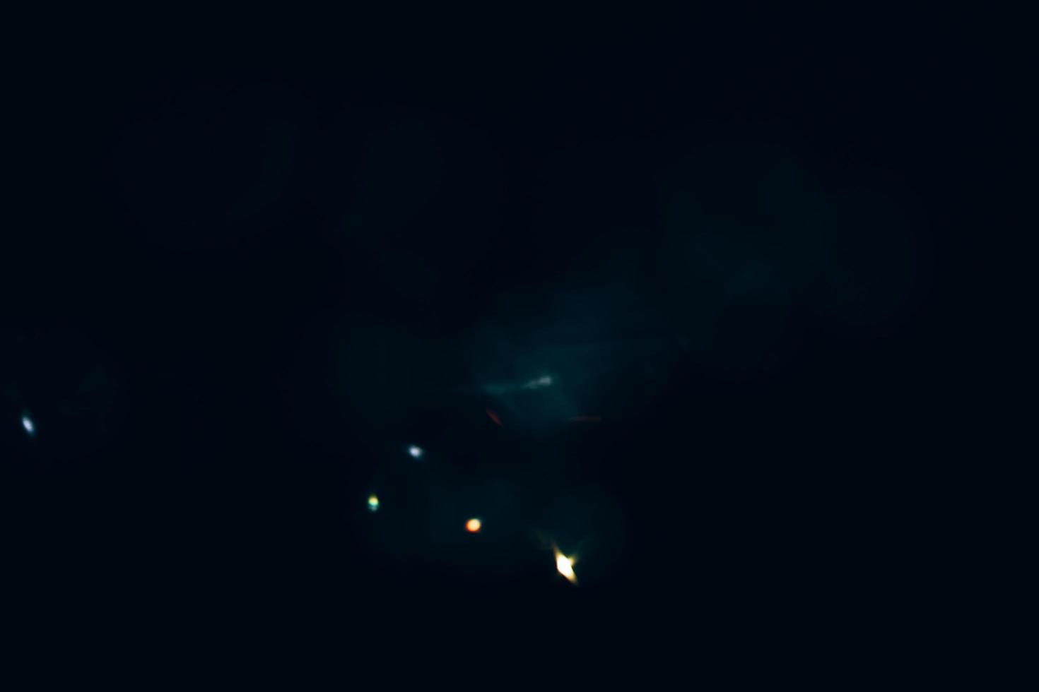 Scratched background. Lens flare effect. Blue distressed aged faded grunge surface with smeared stains dust noise colorful light design. photo