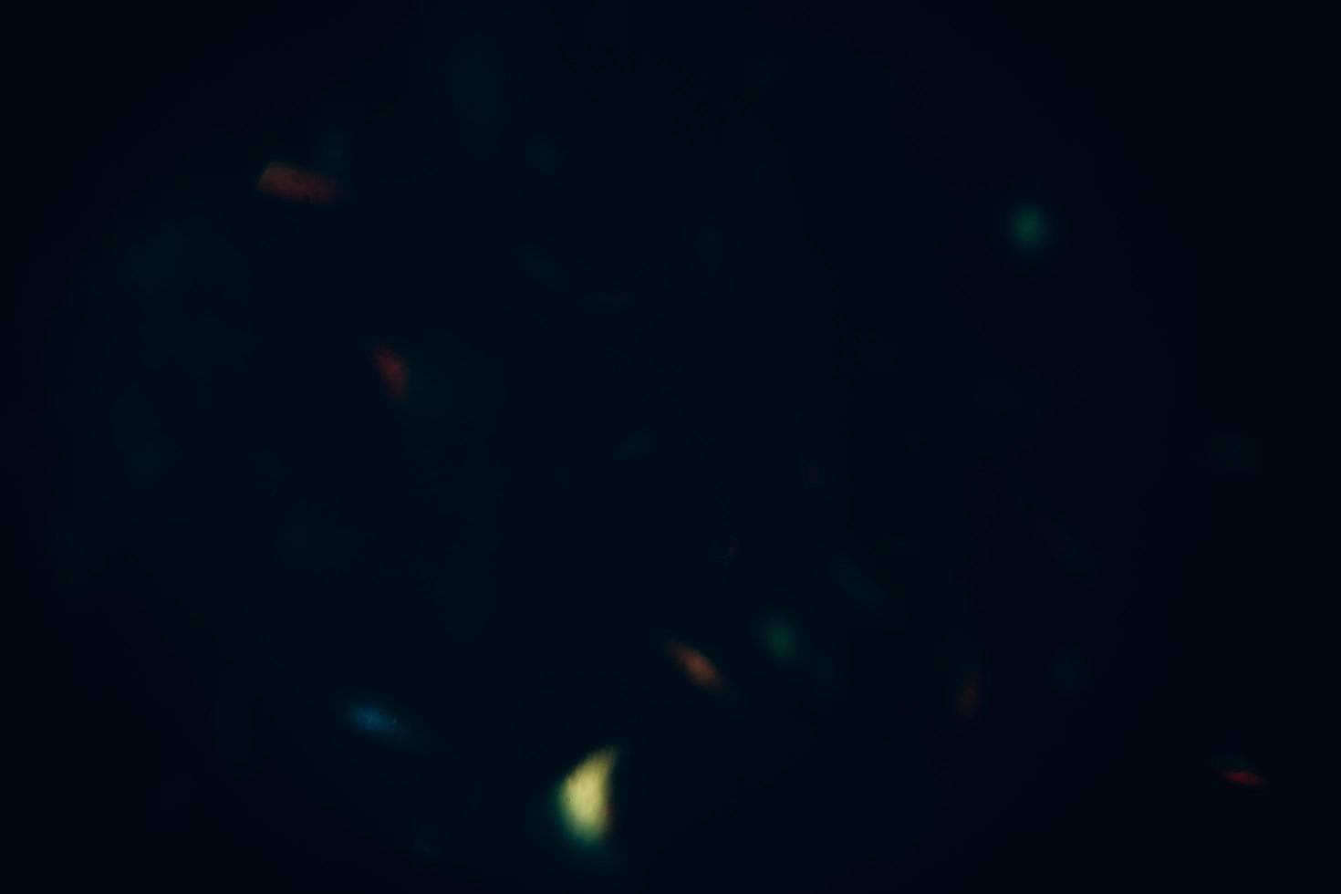 Scratched background. Lens flare effect. Blue distressed aged faded grunge surface with smeared stains dust noise colorful light design. photo