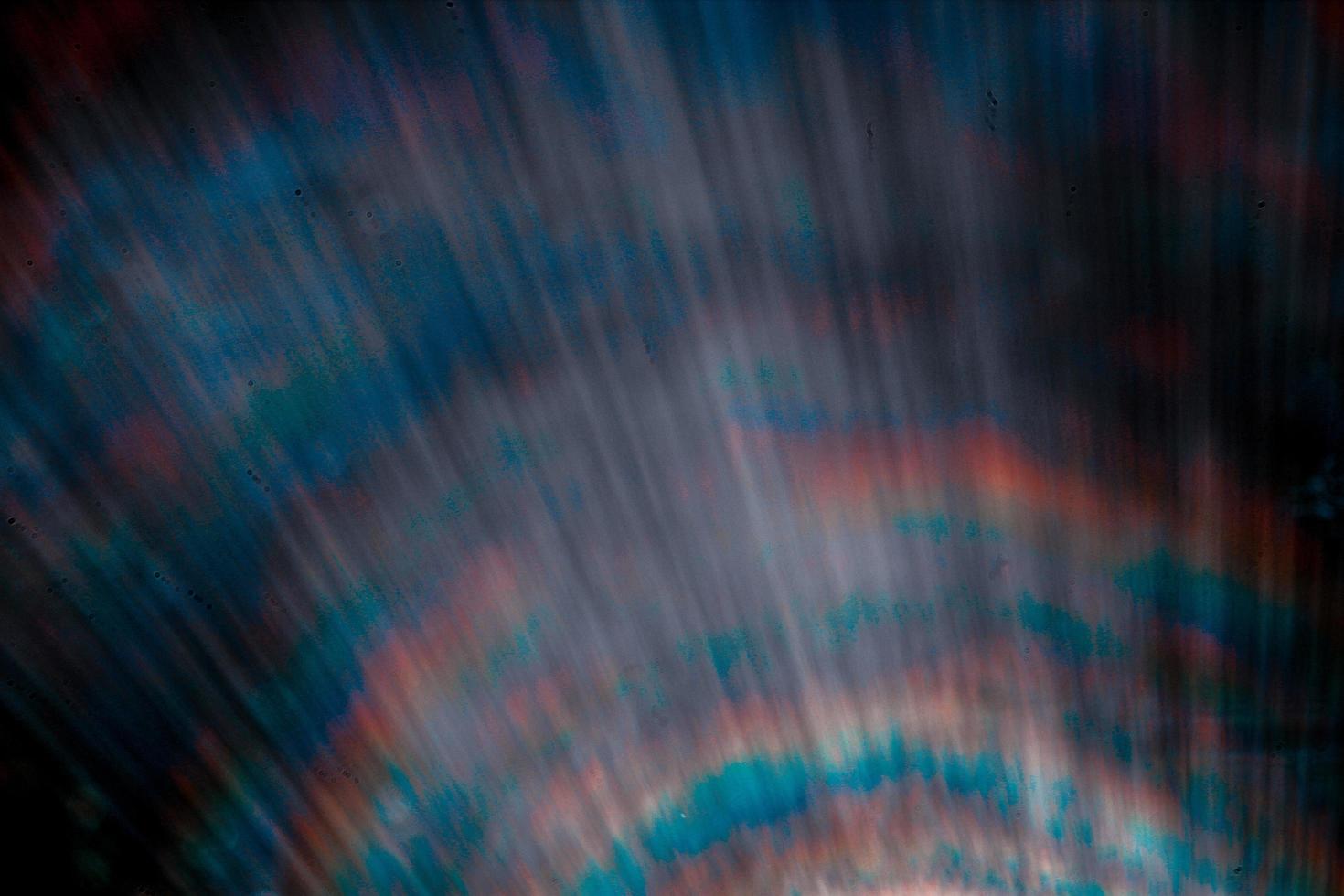 Lens flare and light leak haze texture on a black background. photo