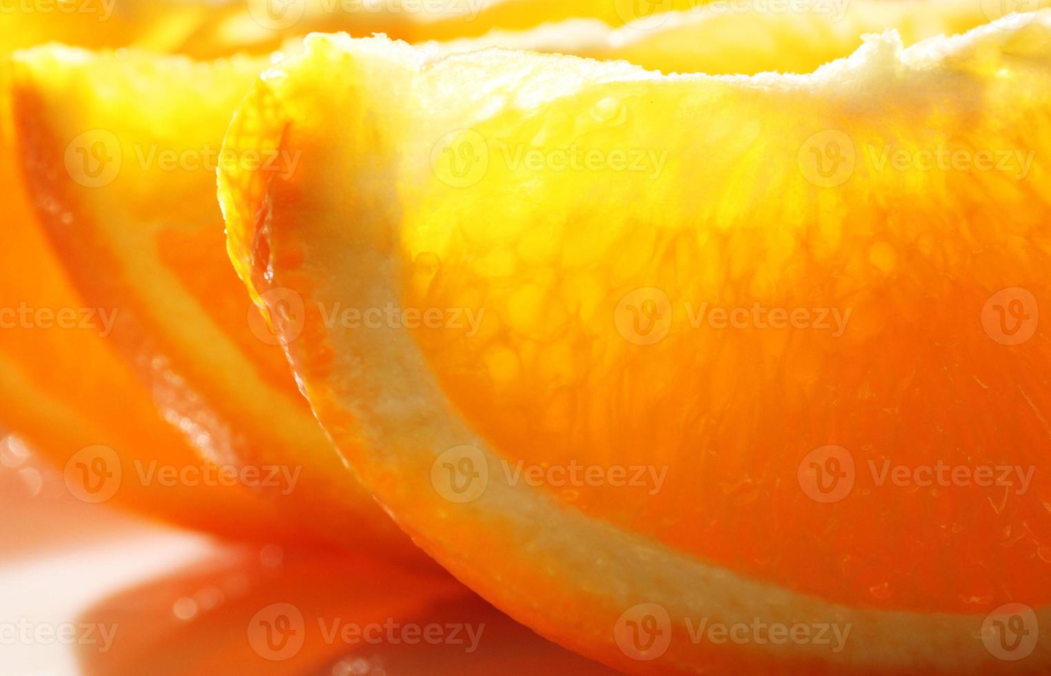 cut of oranges in light photo
