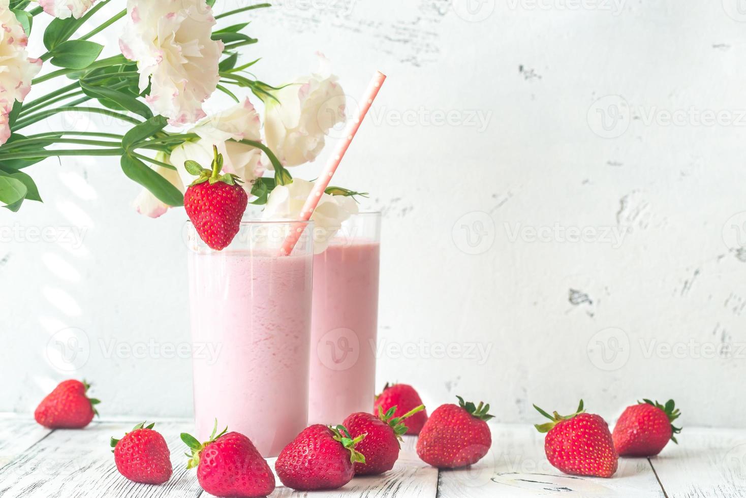 Two glasses of strawberry shake photo