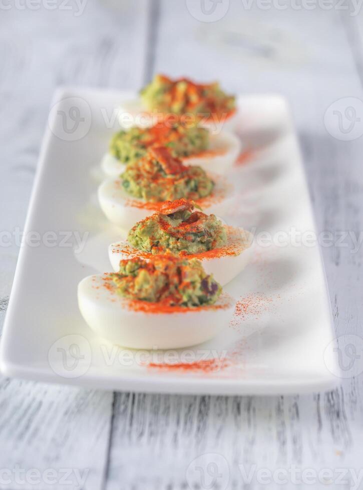 Guacamole and bacon deviled eggs 22510978 Stock Photo at Vecteezy