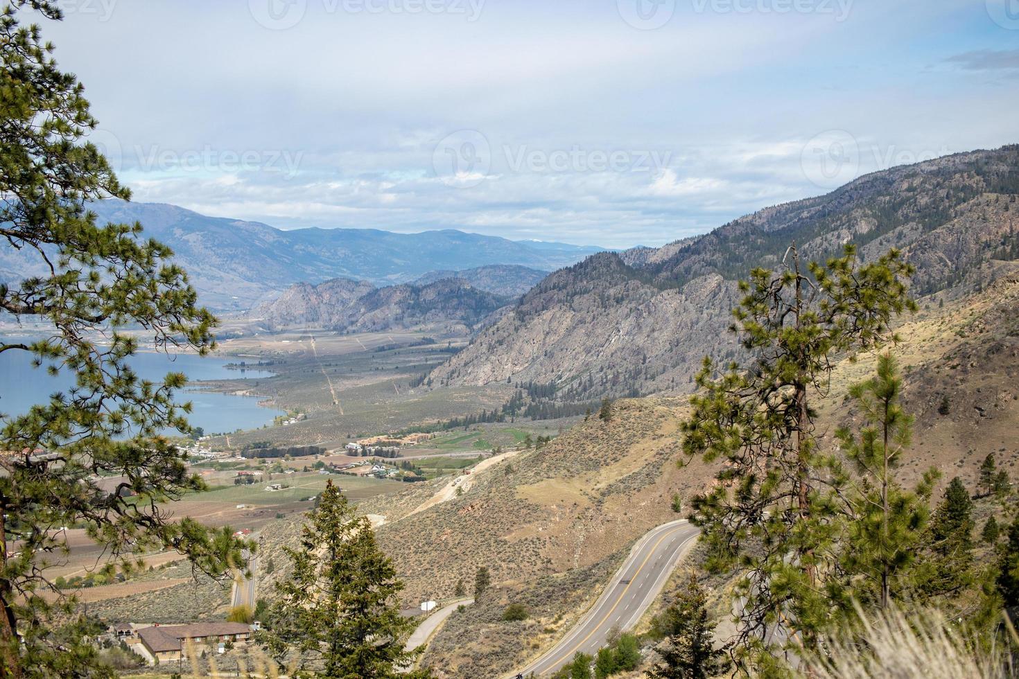 View of mountain highway and lake in the Okanagan Valley in British Columbia photo