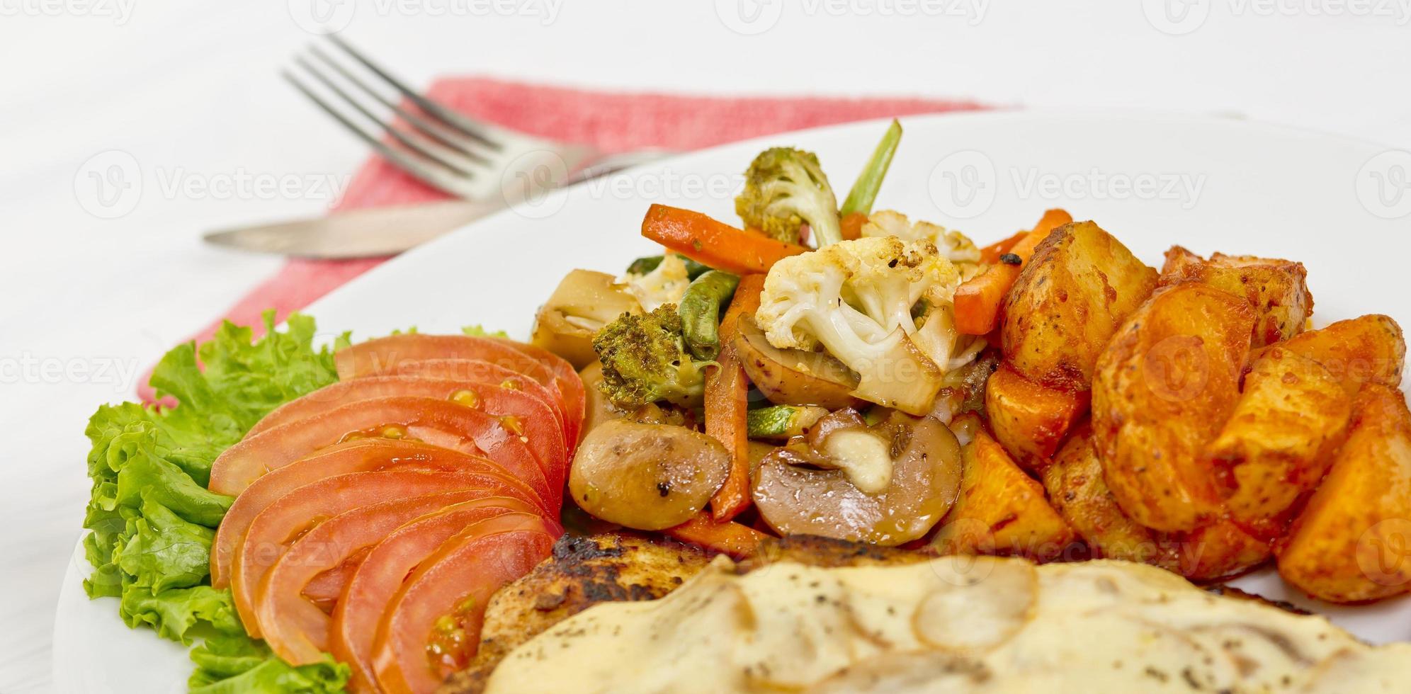 Peri peri Chicken with Button mushroom gravy, Saute Vegetables, Spicy fried Potatoes with Tomato Lettuce Salad. photo