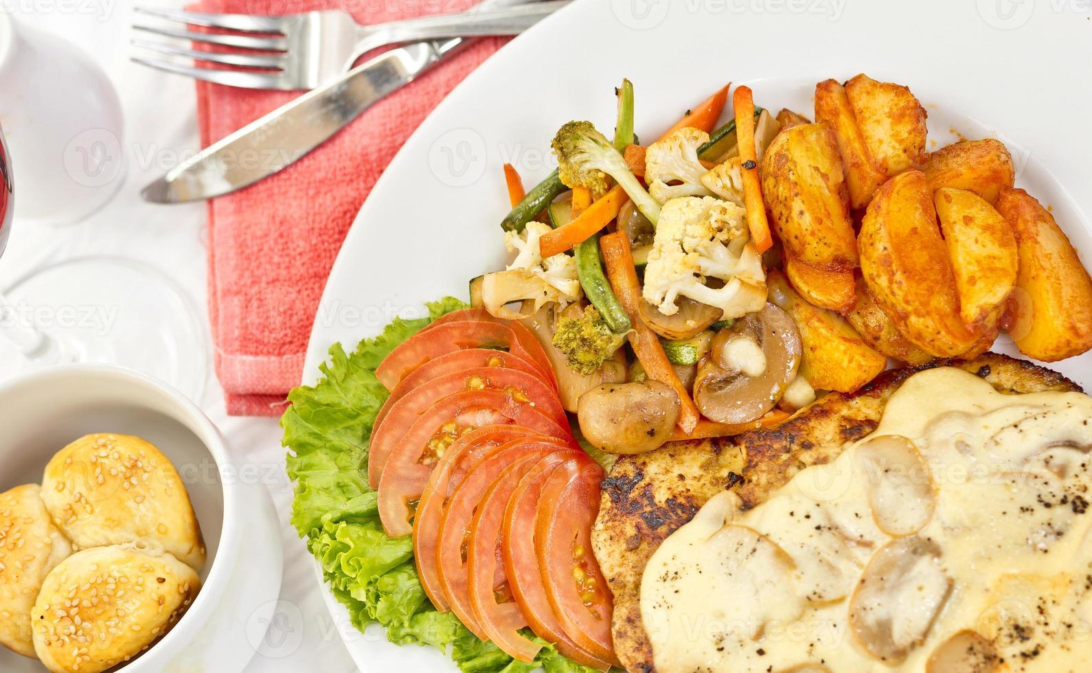 Peri peri Chicken with Button mushroom gravy, Saute Vegetables, Spicy fried Potatoes with Tomato Lettuce Salad. photo