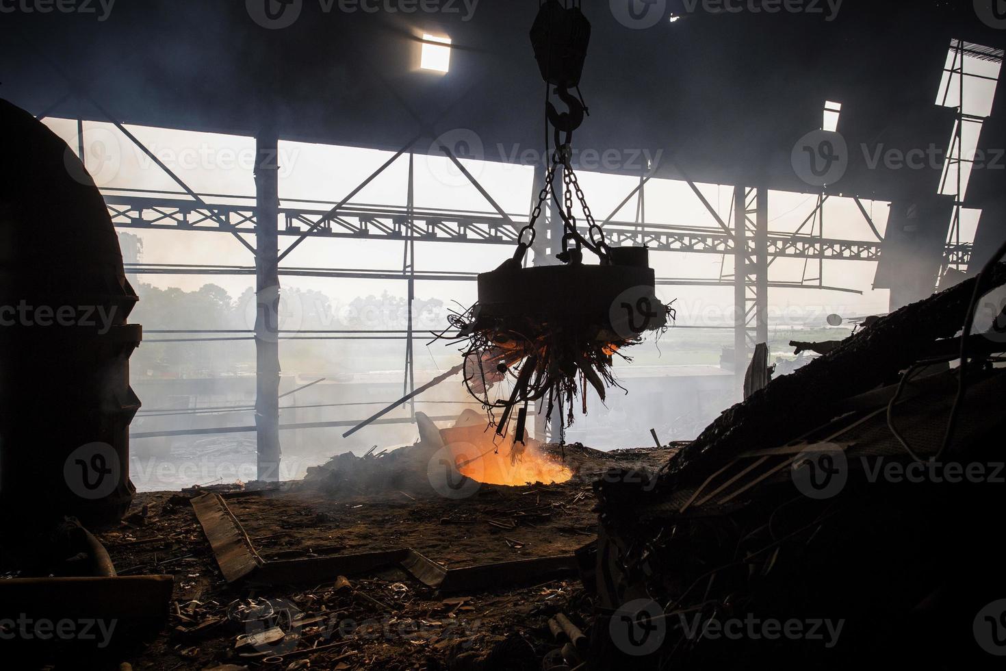 Scrap steel melts down in an induction furnace at Demra, Dhaka, Bangladesh. photo