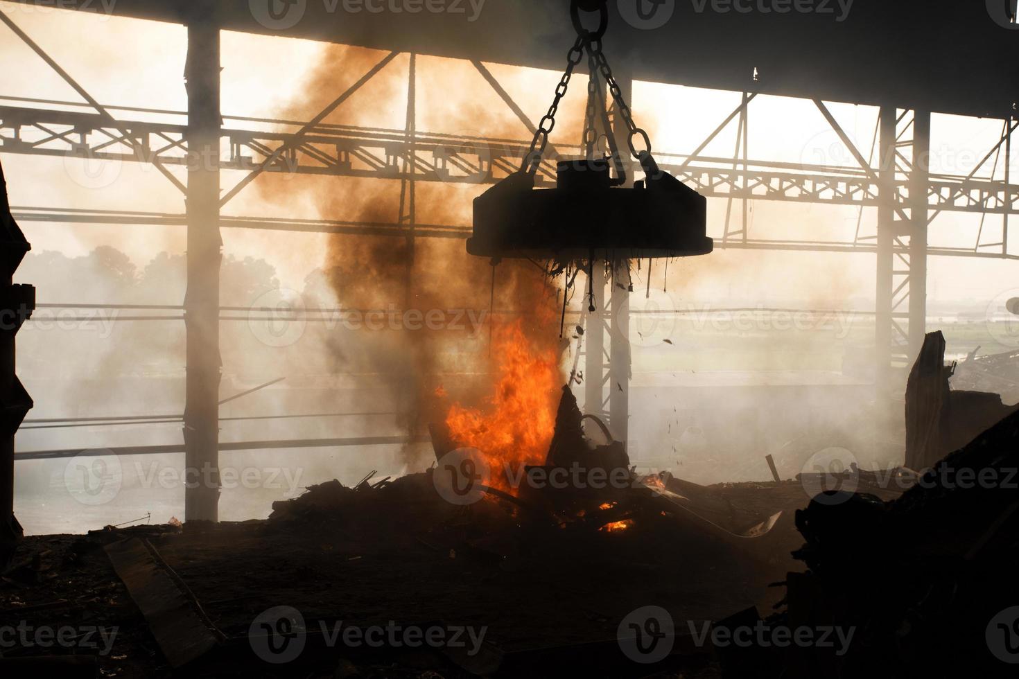 Scrap steel melts down in an induction furnace at Demra, Dhaka, Bangladesh. photo