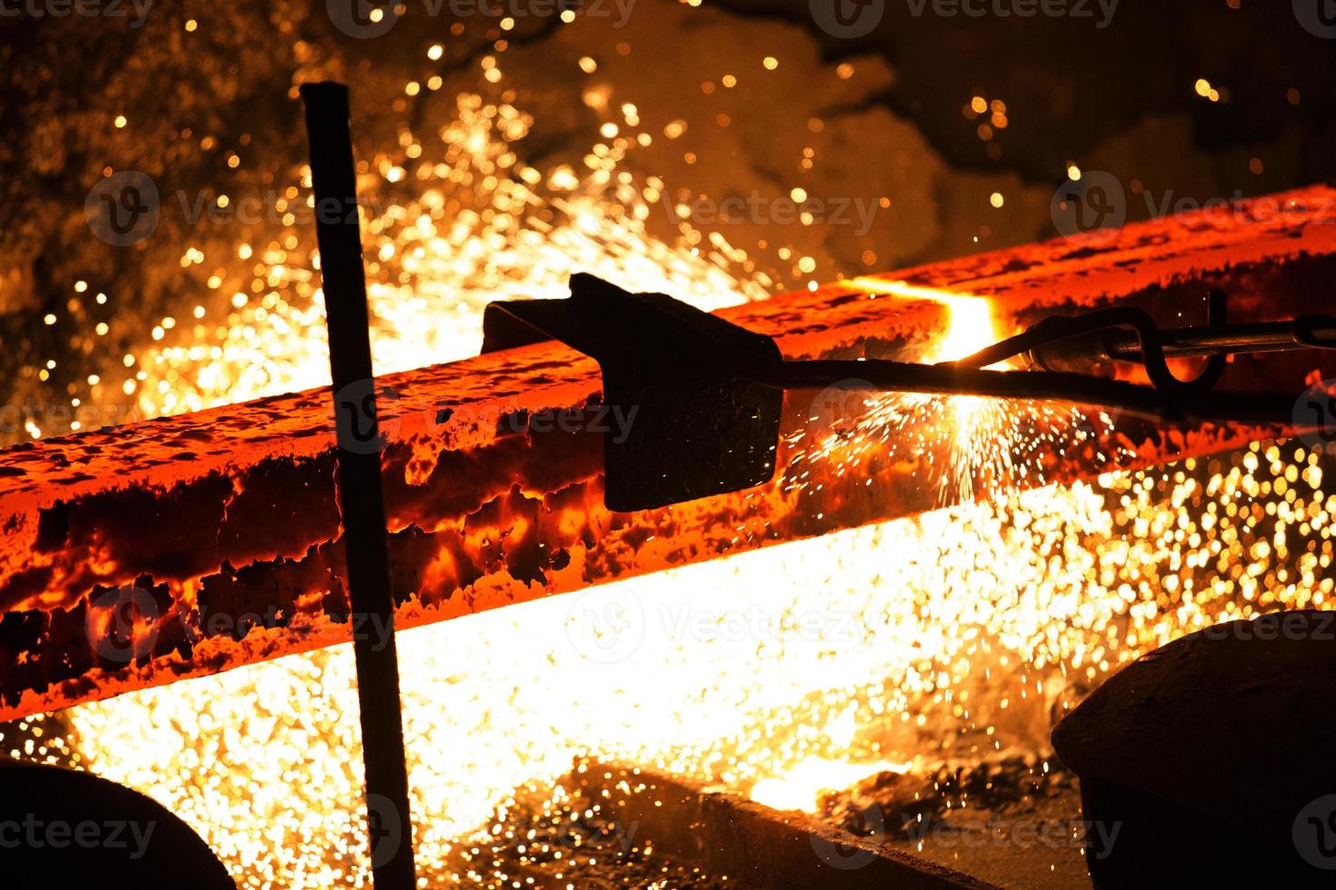 Gas cutting of the hot metal in steel plant at Demra, Dhaka, Bangladesh photo