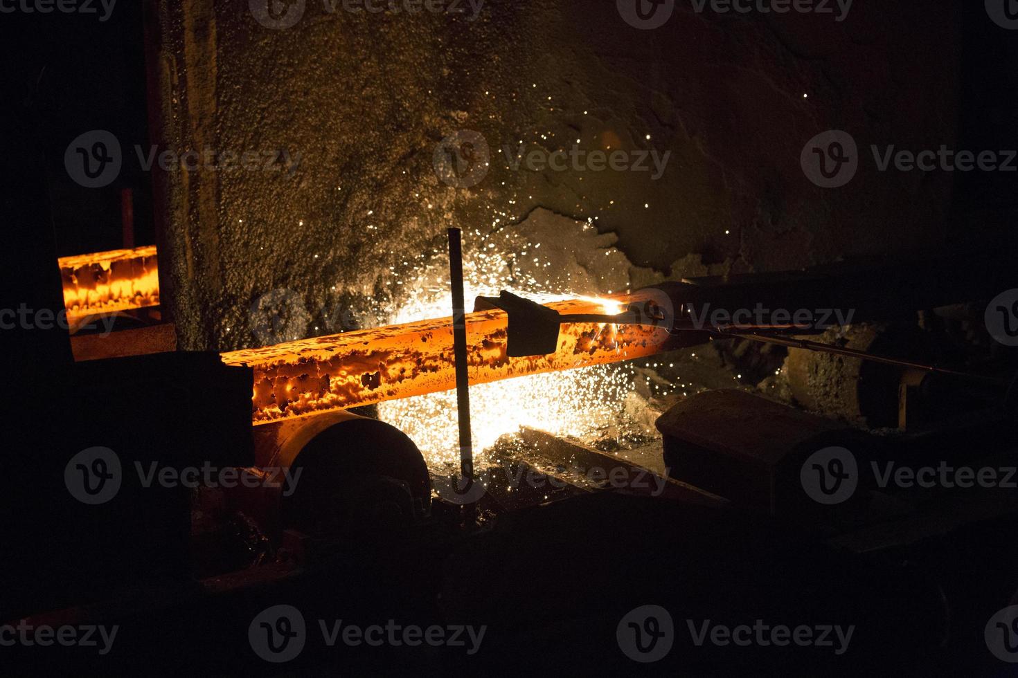 Gas cutting of the hot metal in steel plant at Demra, Dhaka, Bangladesh photo
