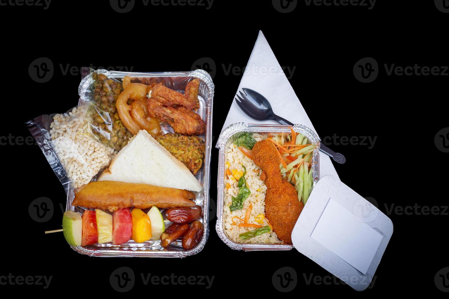 The Food Warmer Aluminum Foil Rectangular Disposable Parcel box. Ramadan iftar Take away delivery. 450ML Foil Container iftar food boxes. Top view, flat lay at white and Black background. photo