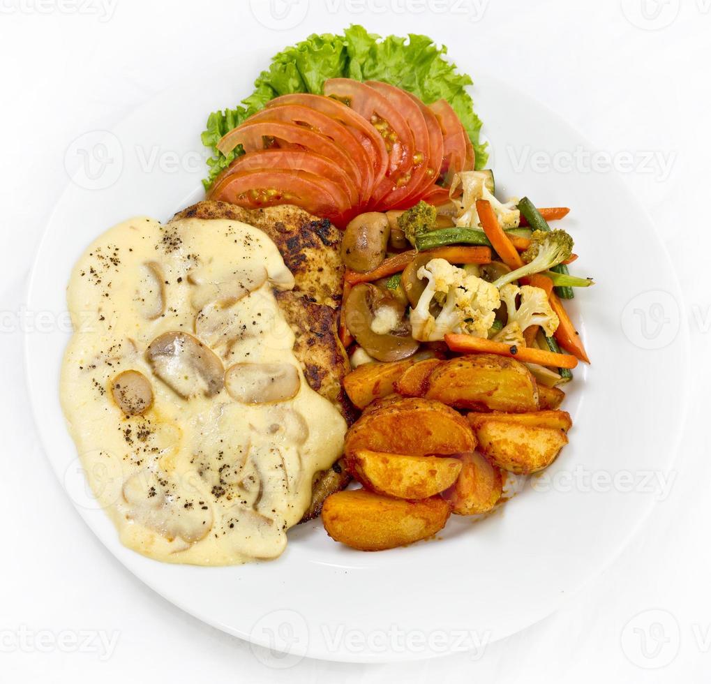 Peri peri Chicken with Button mushroom gravy, Saute Vegetables, Spicy fried Potatoes with Tomato Lettuce Salad. photo