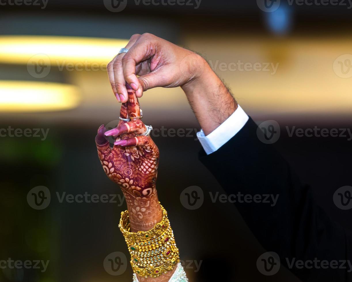 The bride and groom together to move up one finger and trying to dance in wedding day. Western Wedding. photo