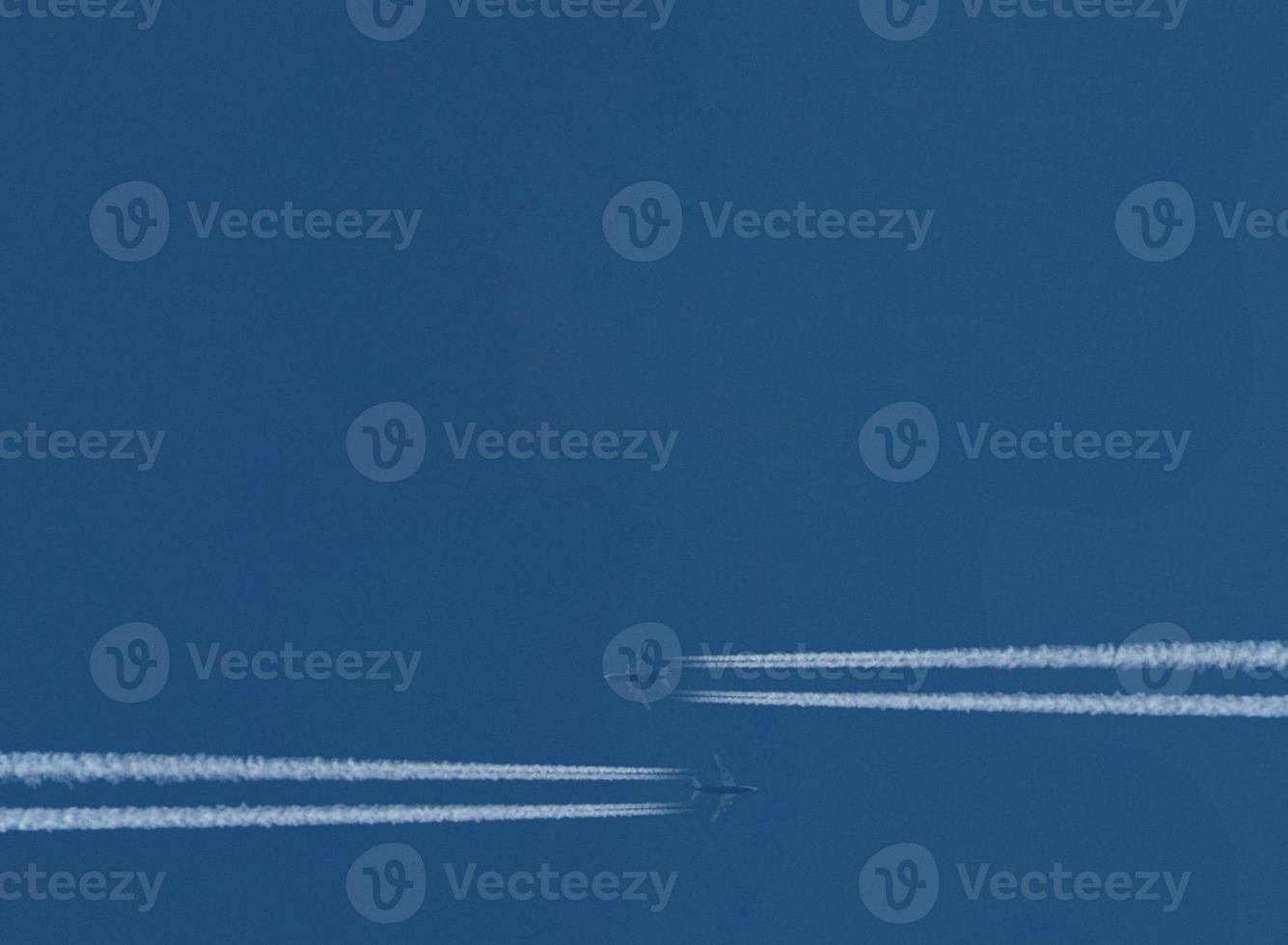 blue sky background with two tracks from planes photo