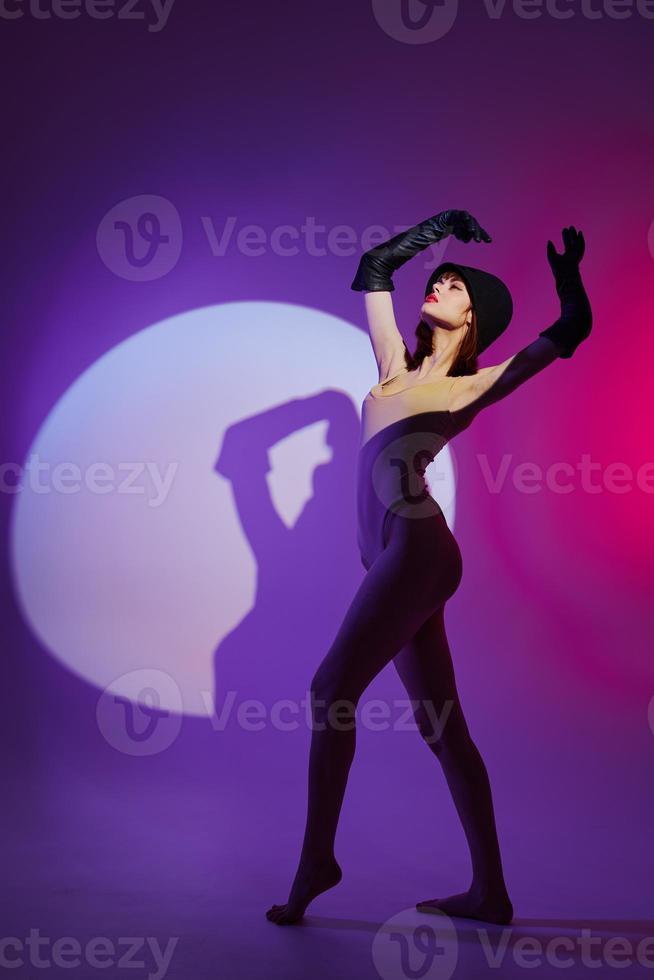 Portrait of a charming lady scene spotlight posing neon purple background unaltered photo