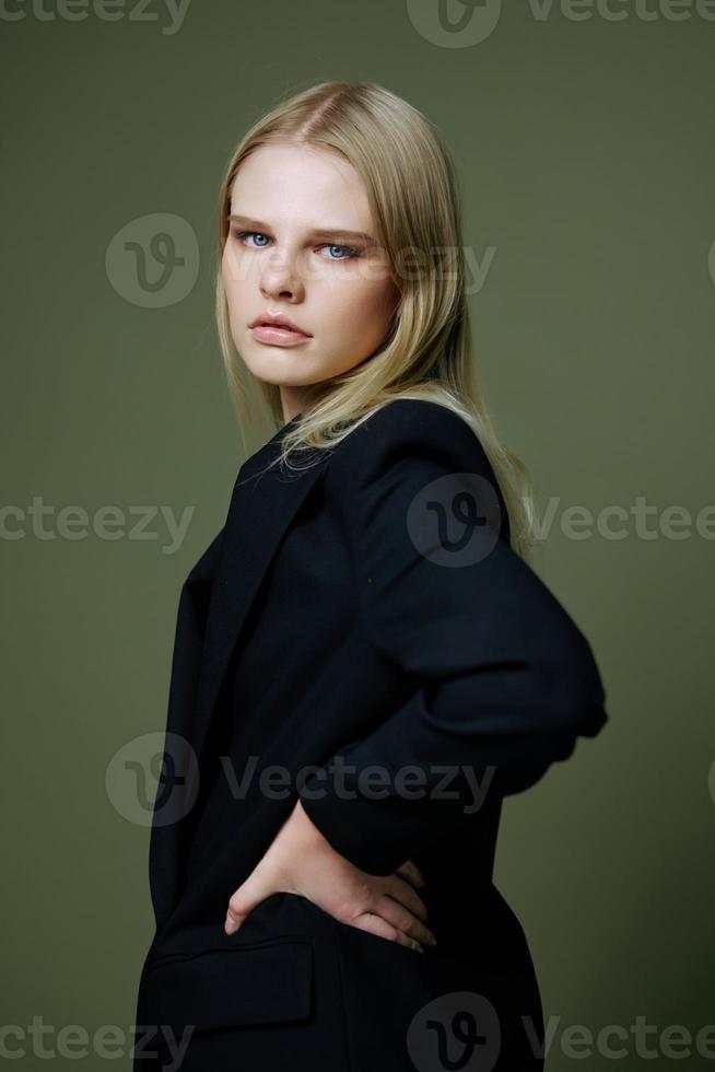 A beautiful attractive girl looks over her shoulder half-turned into the camera. A great banner for a costume and clothing brand. Hot sale offer photo