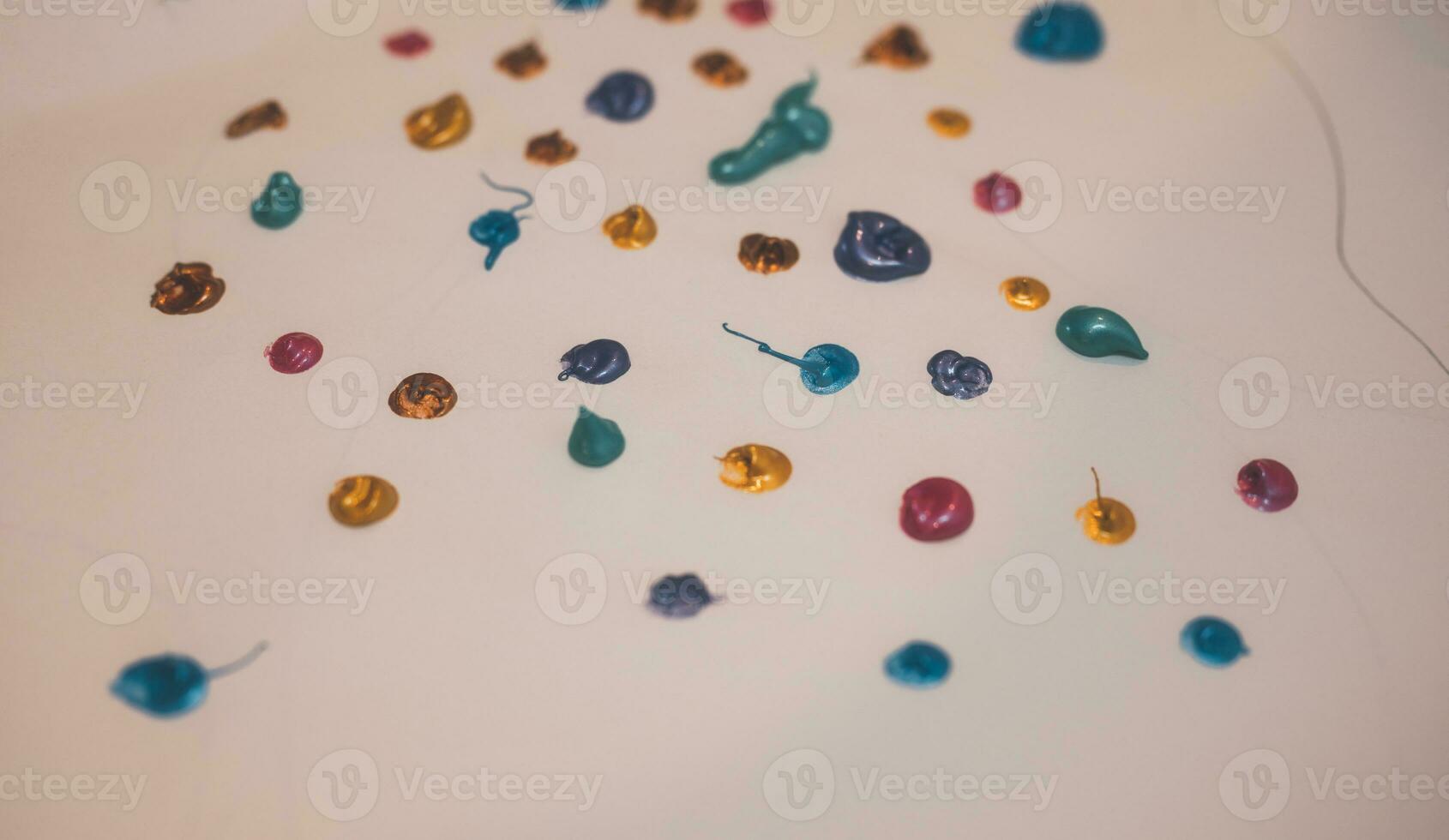 Colorful paint drop splats background on paper , kid activity. photo