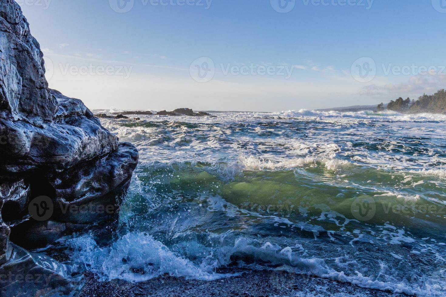 Close up of wave crashing on a rock at Botanical Beach at Juan De Fuca Provincial Park on Vancouver Island, Canada photo