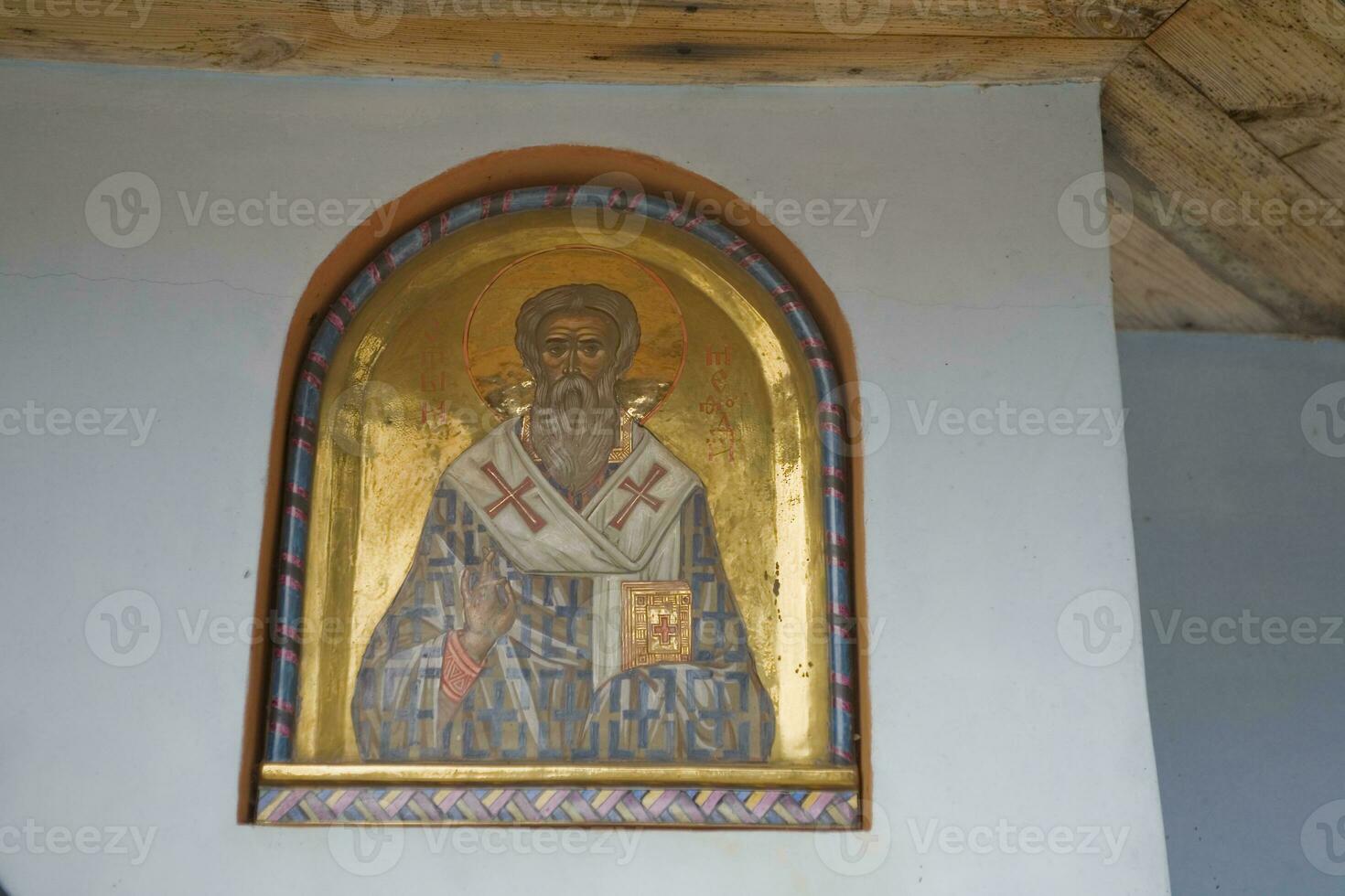 large paintings on the temple wall with Orthodox religious symbols photo