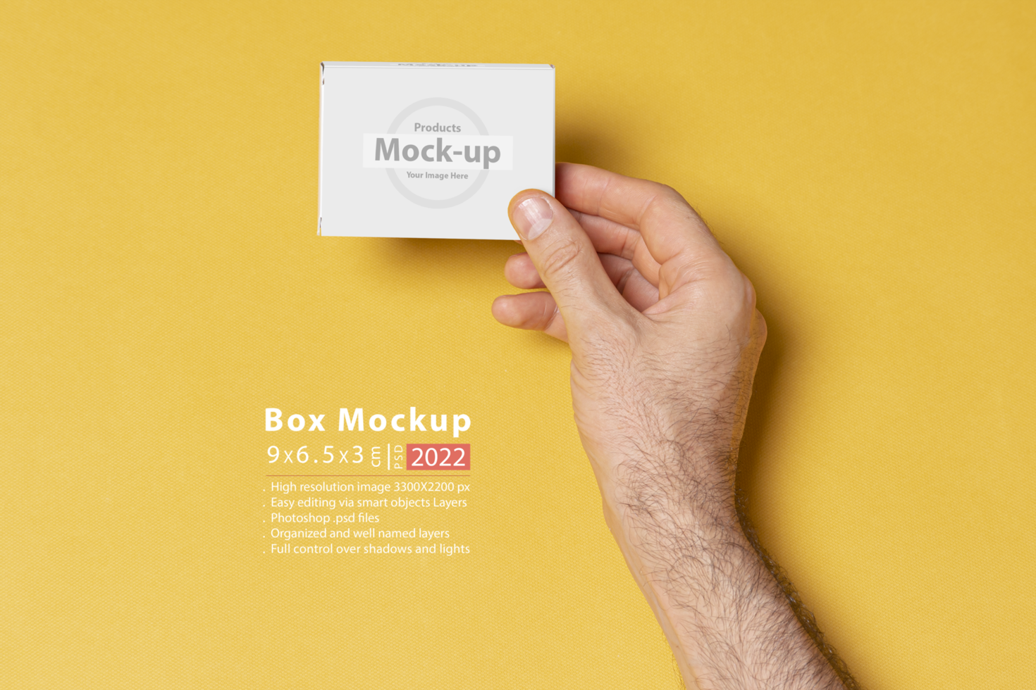 A man hands holding a pillbox in front of yellow background psd